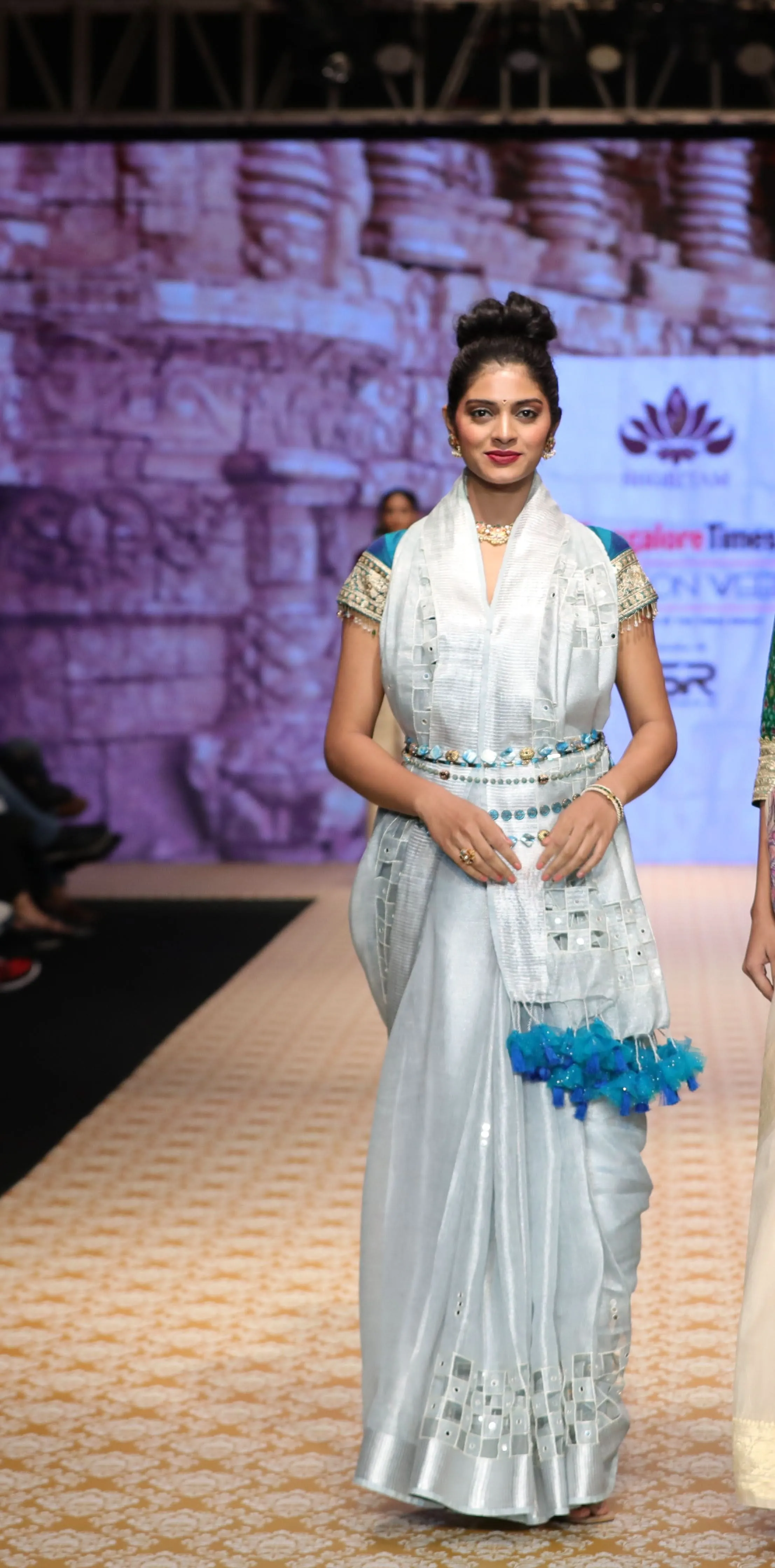 Cutwork and Mirror Work Tissue Linen Saree in White Silver with dramatic tassels